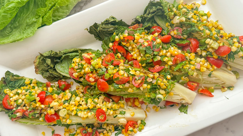 Grilled romaine salad on platter