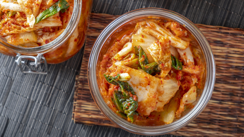 Overhead view of fermented kimchi in a jar