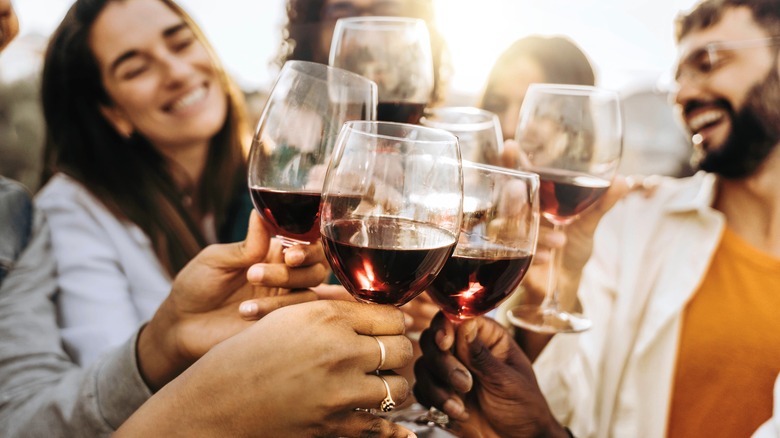 Group toasting wine glasses