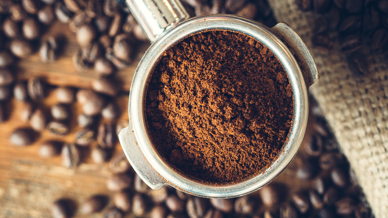 coffee grounds above beans to make espresso