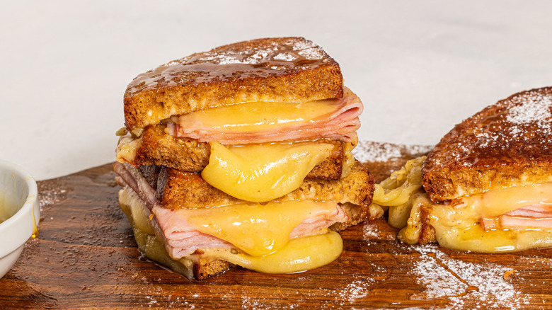 Monte Cristo sandwich sliced in half and stacked one on top of the other