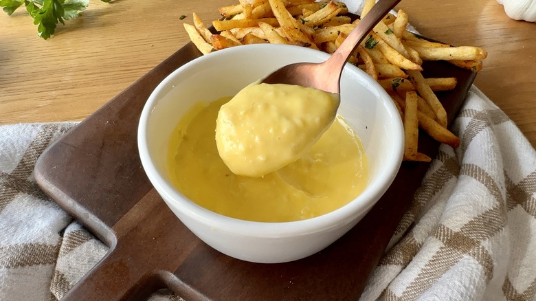 Spoon in bowl of aioli