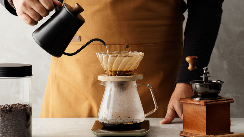 pouring water over coffee