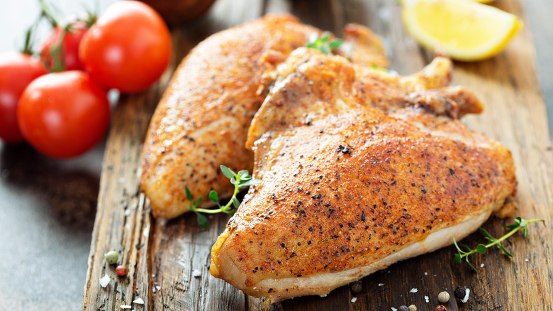 Chicken breast on cutting board