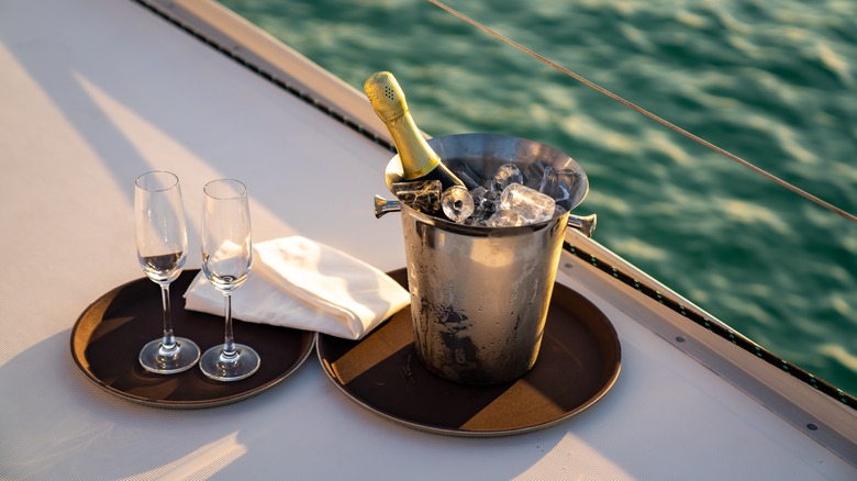 Champagne dipped in ice bucket.