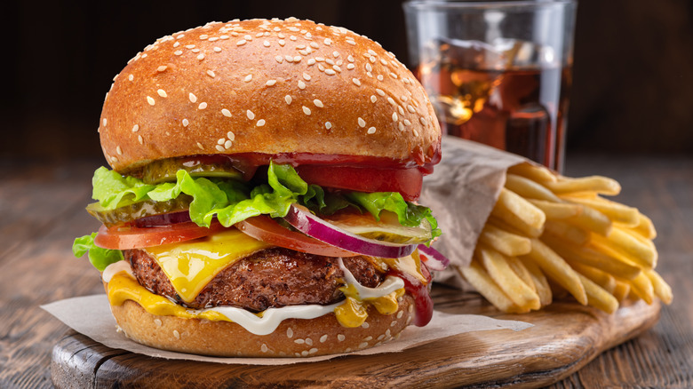 hamburger with fries and a drink 