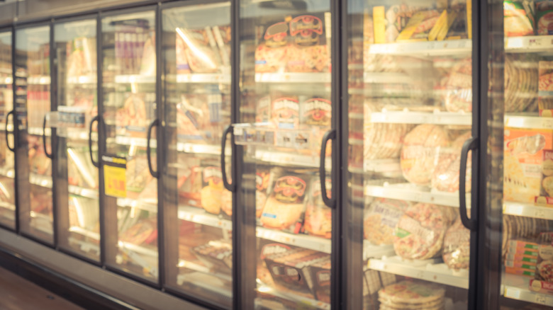 Frozen pizza in store freezers