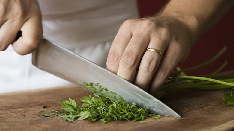 Man chopping herbs