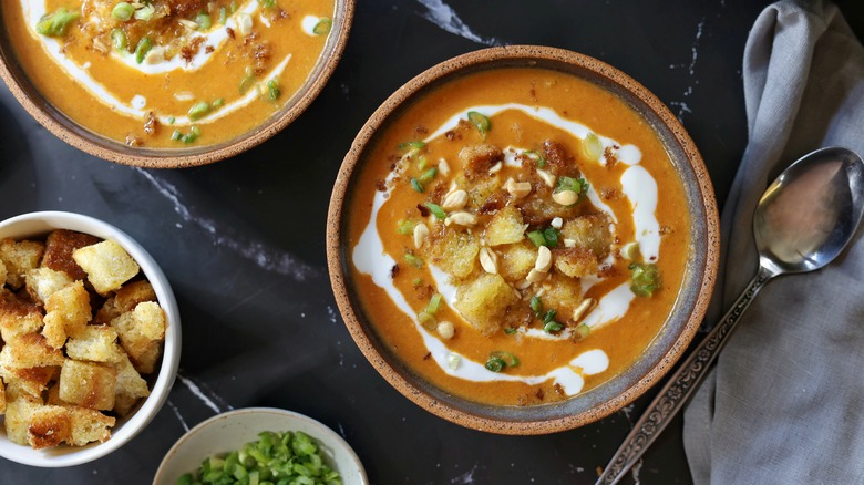 bowls of panang curry tomato bisque