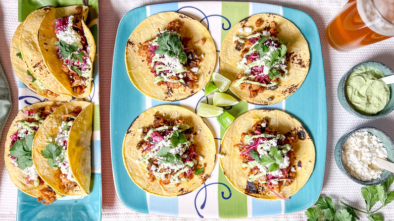 Roasted cauliflower tacos with the works on serving platter