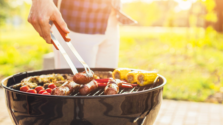 Person grilling meat