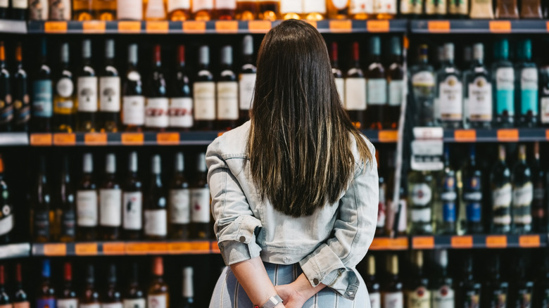 Woman shopping for wine