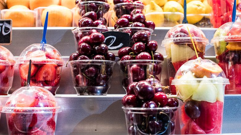 plastic cups of prepared fruit