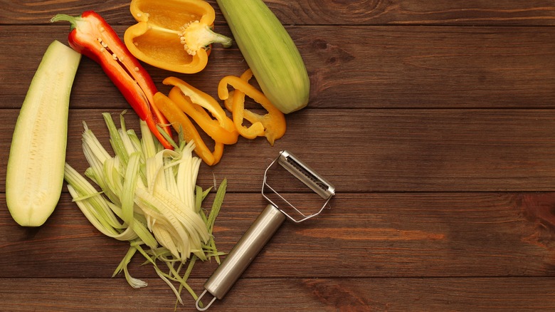 sliced vegetables and peeler