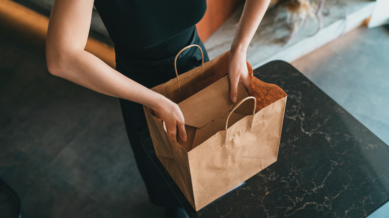 Taking out food delivery box