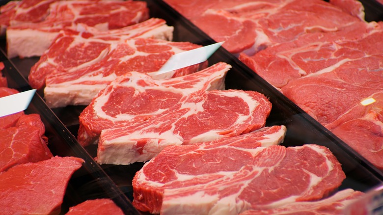 Raw steak on store shelf