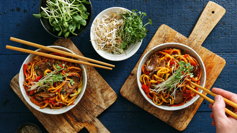 Bowls of stirfry with chopsticks