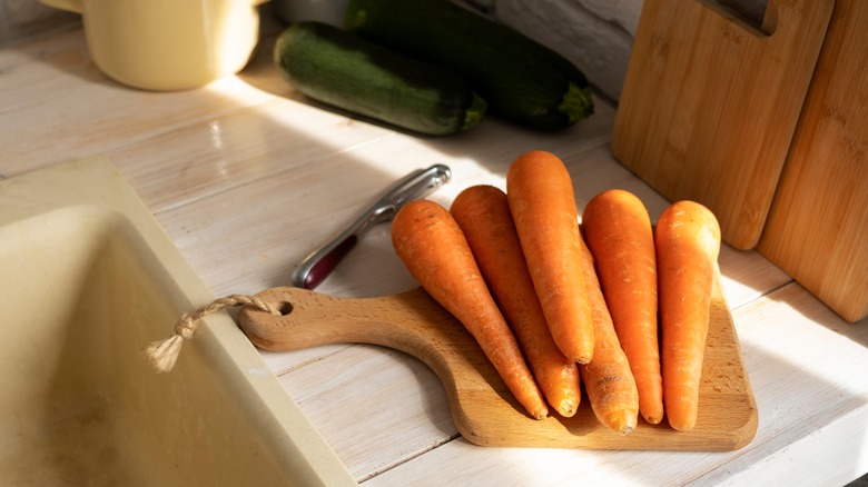 Fresh whole carrots on counter