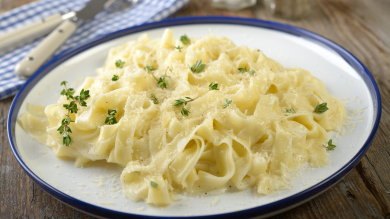 Fettuccine alfredo bowl on table