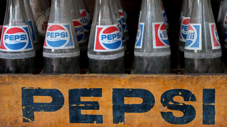 Pepsi bottles in wooden crate 