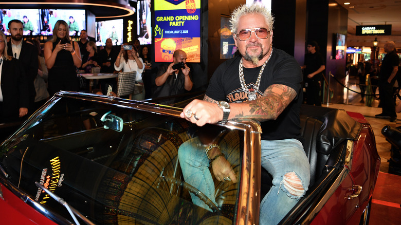 Guy Fieri in a car