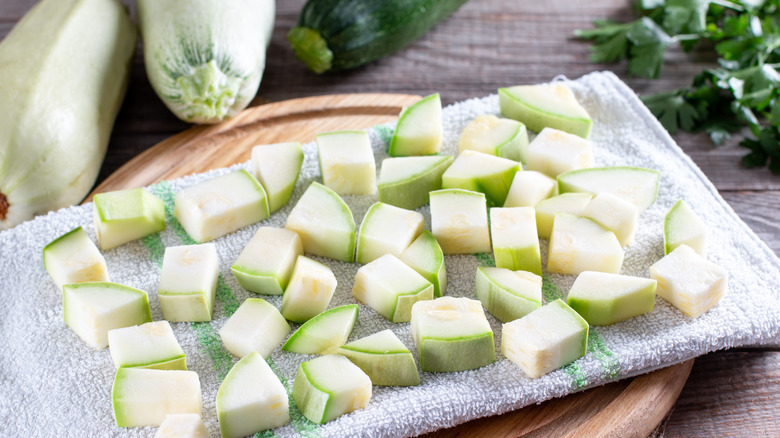 Chunks of frozen zucchini on towel