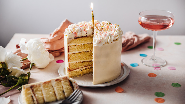 Layered birthday cake on plate