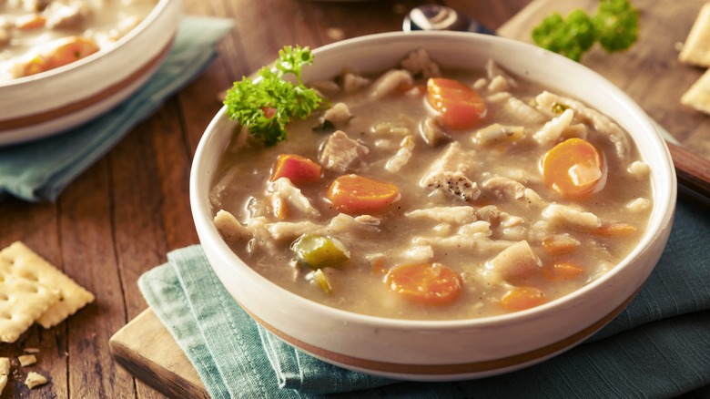 Chicken and dumplings in bowl