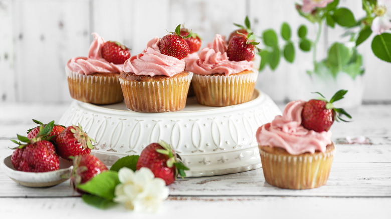 Strawberry cupcakes on white background