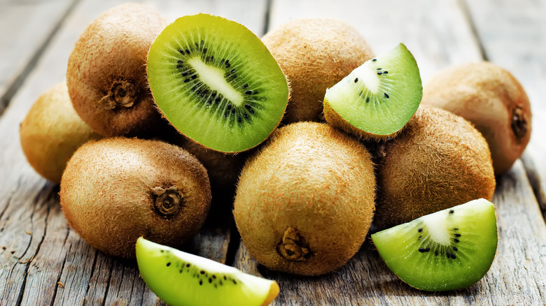 Pile of kiwis on wood