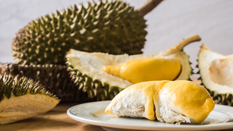 Whole and sliced durian