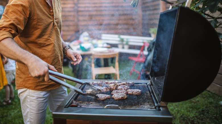 Man using barbecue grill