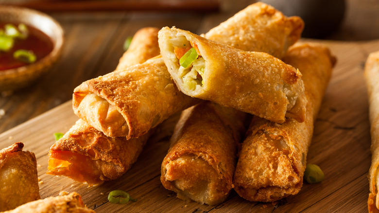 Egg rolls on cutting board