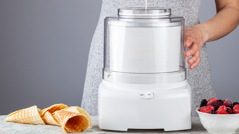 Woman using ice cream maker