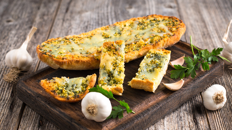 Garlic bread on wooden board