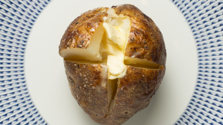 Baked potato cut in quarters