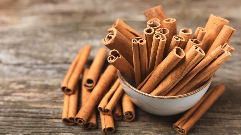 cinnamon sticks in white bowl