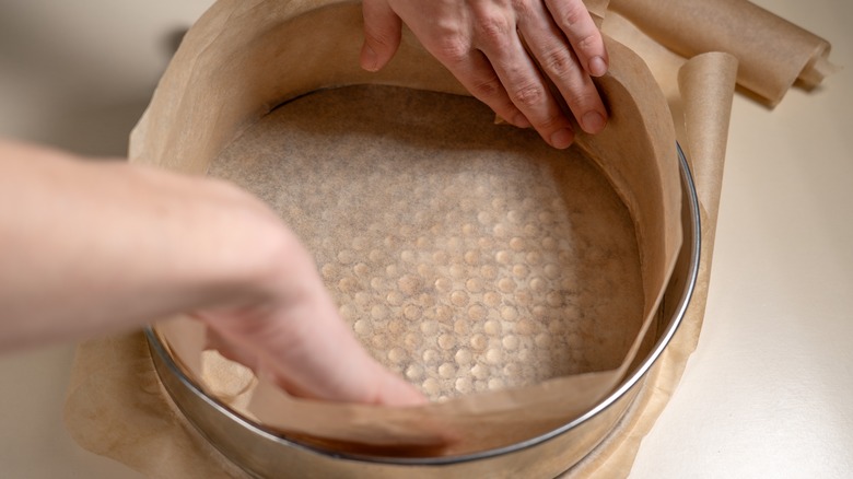 Lining a pan with paper