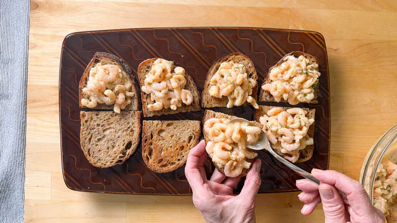 Shrimp salad on rye toasts on serving platter