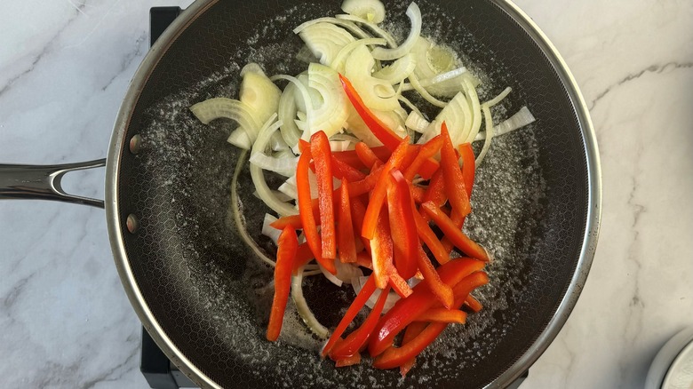 peppers and onions in pan