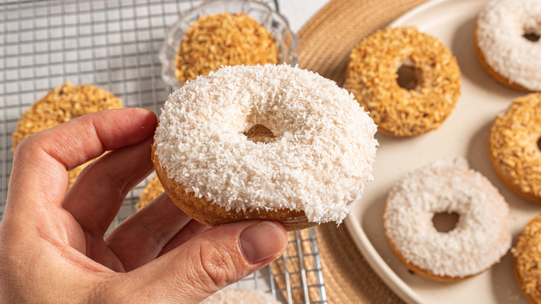 Holding a coconut baked donut